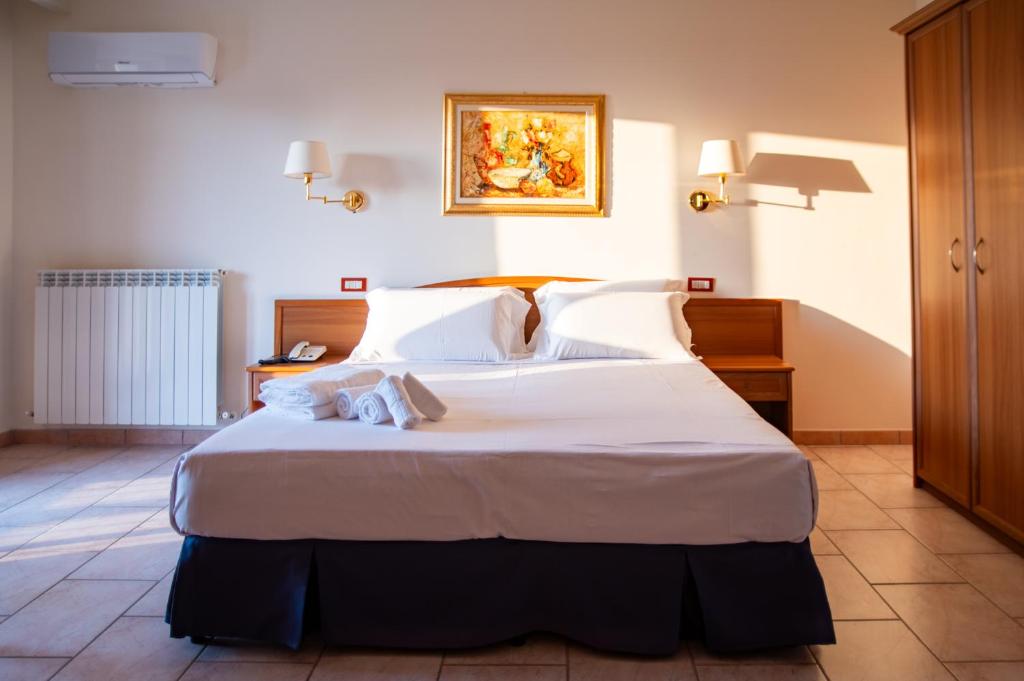 Postel nebo postele na pokoji v ubytování Hotel Bisanzio Resort