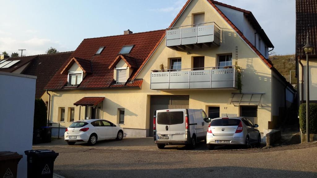 two cars parked in a parking lot in front of a house at Herbrechtingen Eselsburg in Herbrechtingen