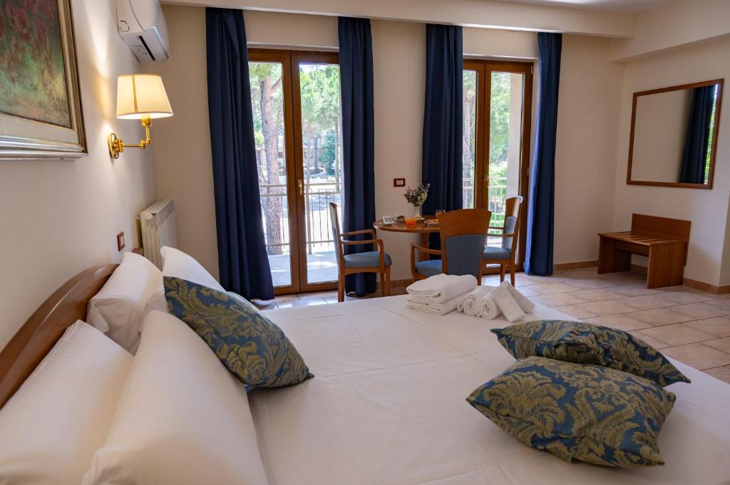 Postel nebo postele na pokoji v ubytování Hotel Bisanzio Resort