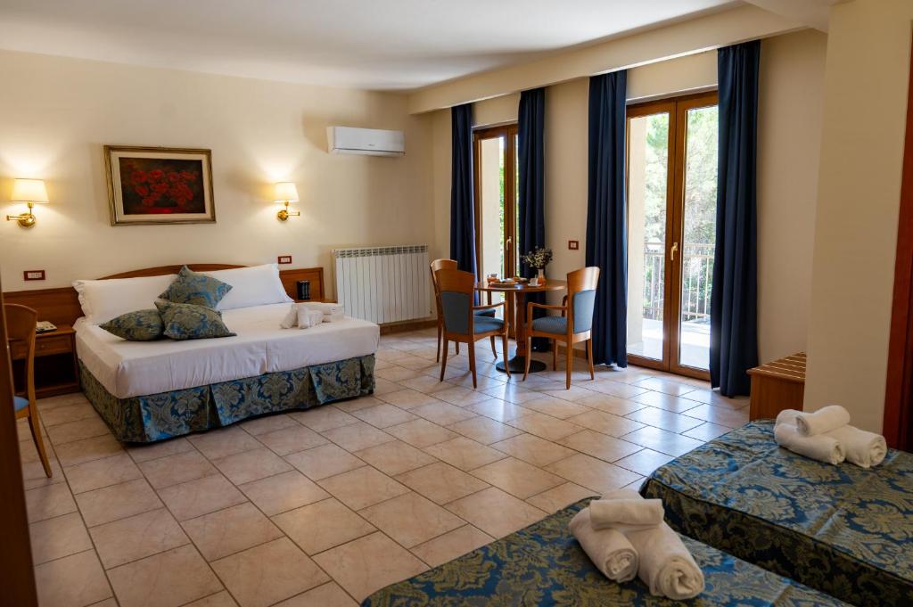 Postel nebo postele na pokoji v ubytování Hotel Bisanzio Resort