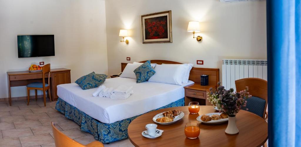 Postel nebo postele na pokoji v ubytování Hotel Bisanzio Resort