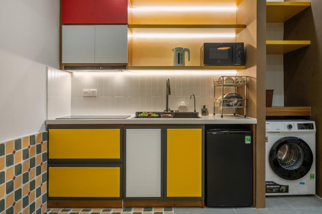 Kuchyň nebo kuchyňský kout v ubytování Q Apartment Da Nang