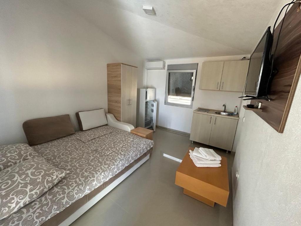 Postel nebo postele na pokoji v ubytování Apartmani ZMS