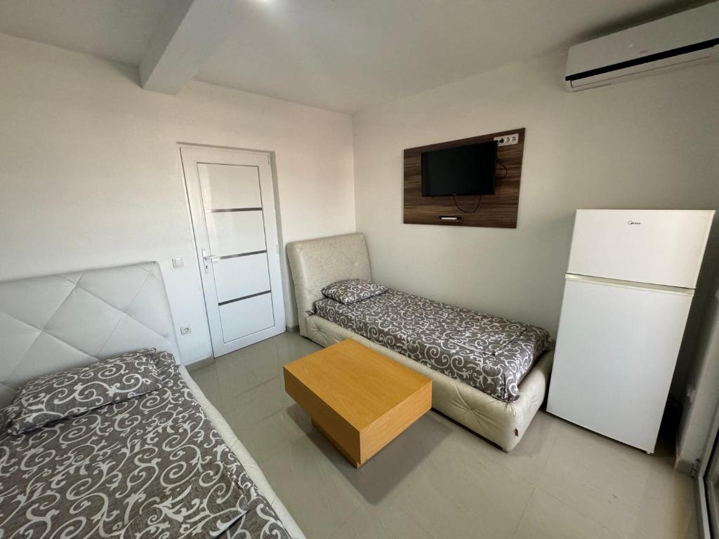 Postel nebo postele na pokoji v ubytování Apartmani ZMS