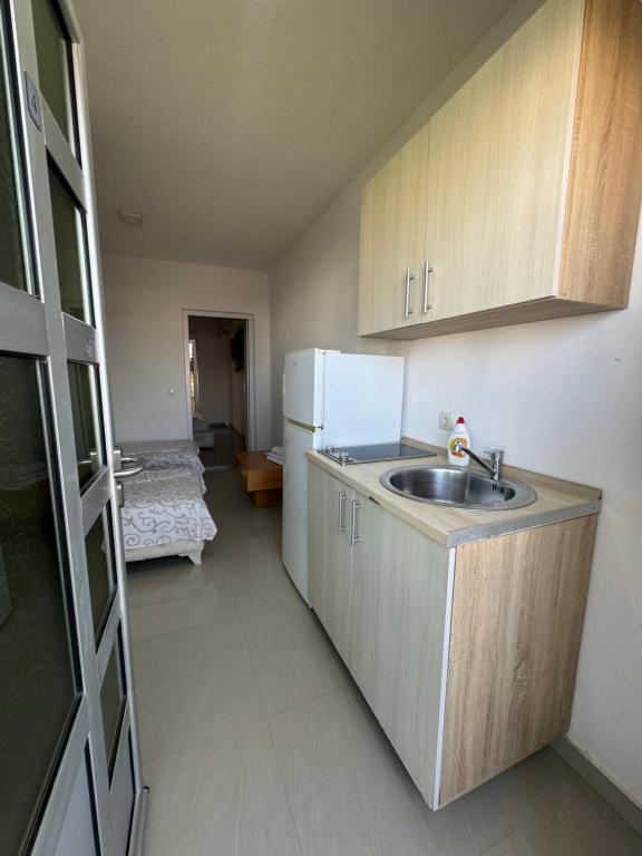 Kuchyň nebo kuchyňský kout v ubytování Apartmani ZMS