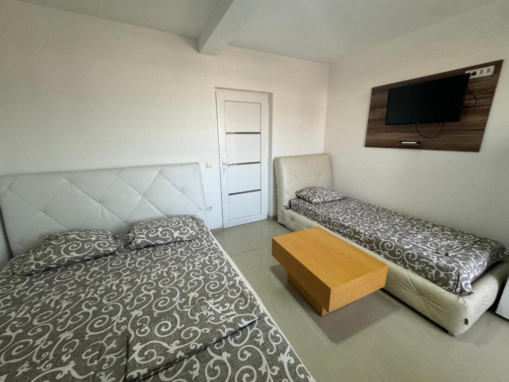 Postel nebo postele na pokoji v ubytování Apartmani ZMS