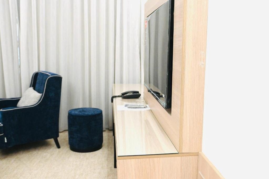 TV a/nebo společenská místnost v ubytování شقق مشراق هوم للأجنحة الفندقية