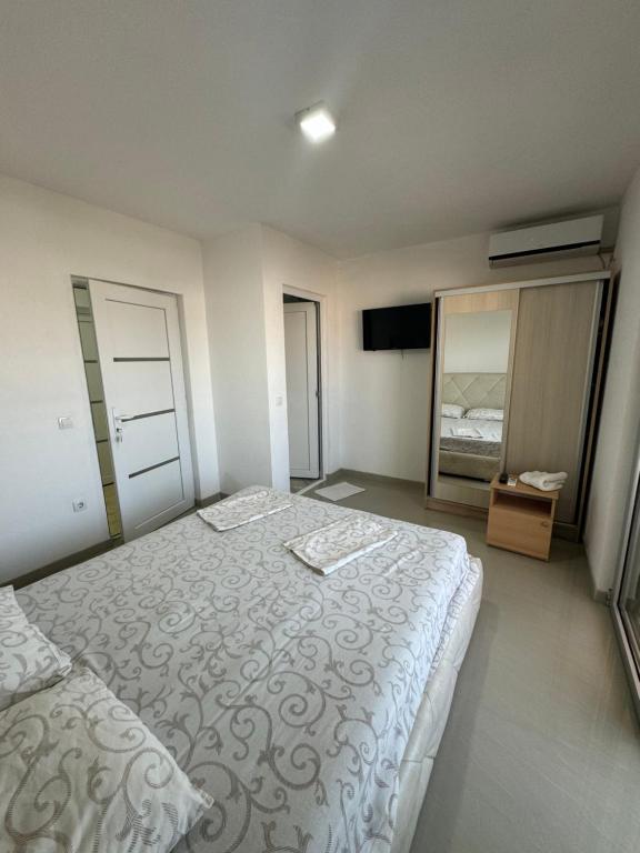 Postel nebo postele na pokoji v ubytování Apartmani ZMS