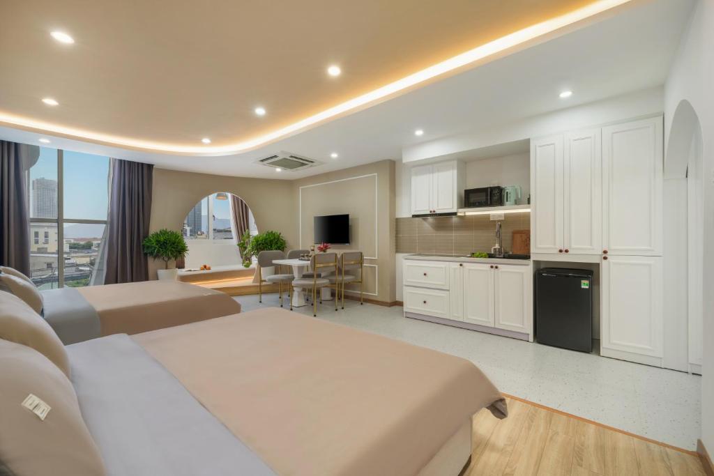 Kuchyň nebo kuchyňský kout v ubytování Q Apartment Da Nang