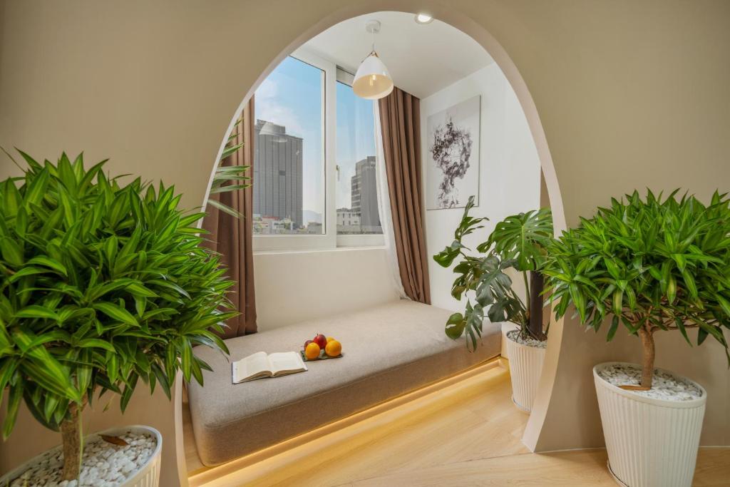 Postel nebo postele na pokoji v ubytování Q Apartment Da Nang