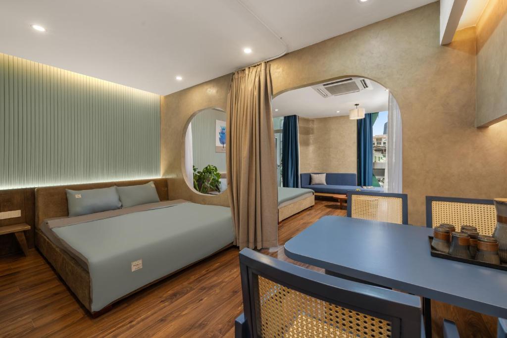 Postel nebo postele na pokoji v ubytování Q Apartment Da Nang