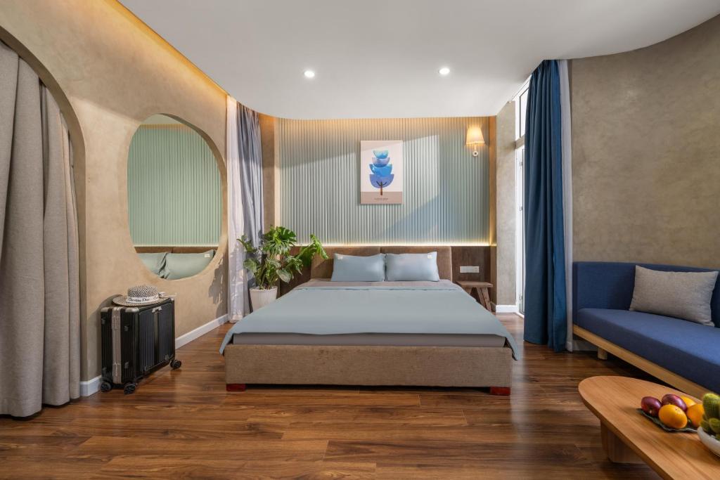 Postel nebo postele na pokoji v ubytování Q Apartment Da Nang