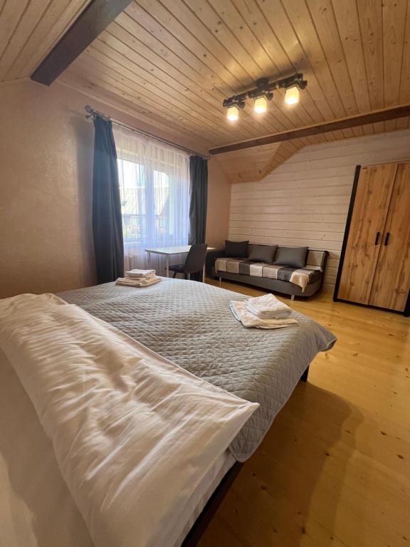 Postel nebo postele na pokoji v ubytování Kolos house