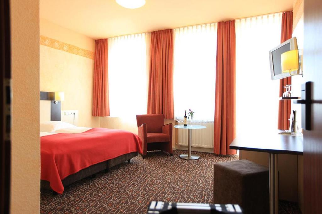 Postel nebo postele na pokoji v ubytování Adesso Hotel Kassel -pay at property on arrival- Ihr Automatenhotel in Kassel