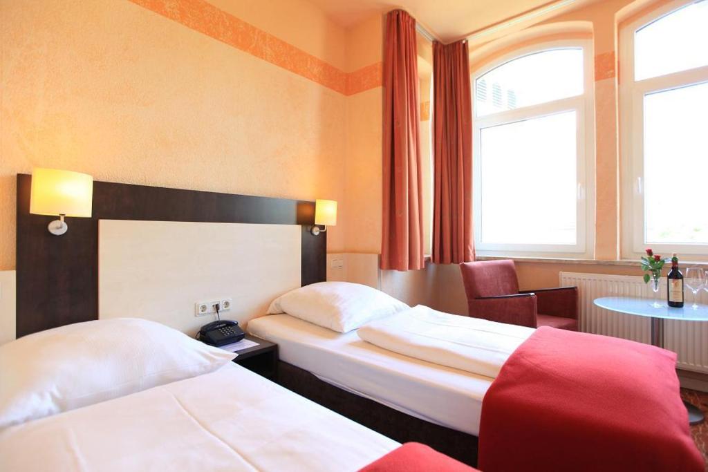 Postel nebo postele na pokoji v ubytování Adesso Hotel Kassel -pay at property on arrival- Ihr Automatenhotel in Kassel