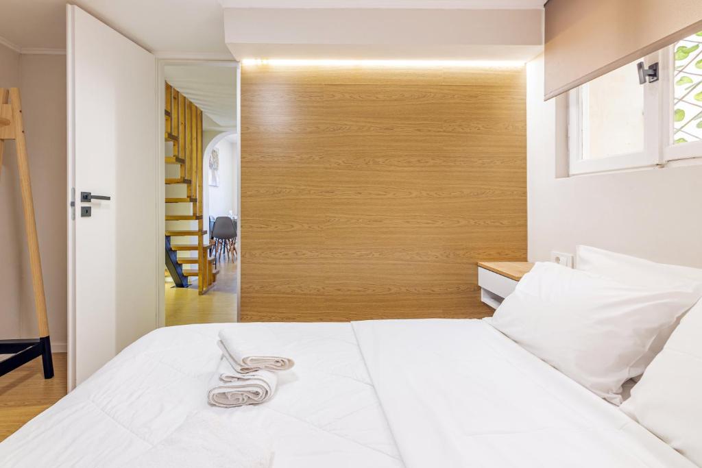 A bed or beds in a room at Stef&Art Old Town House