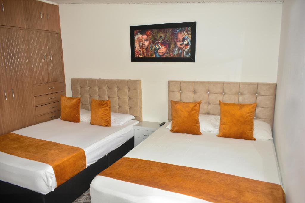 Postel nebo postele na pokoji v ubytování Hotel Flamante Bulevar