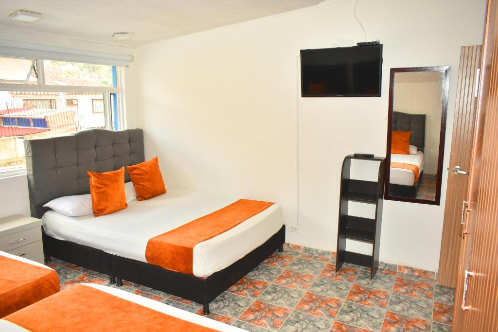 Postel nebo postele na pokoji v ubytování Hotel Flamante Bulevar