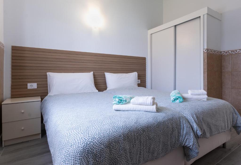 Łóżko lub łóżka w pokoju w obiekcie Bungalow Playa del Inglés