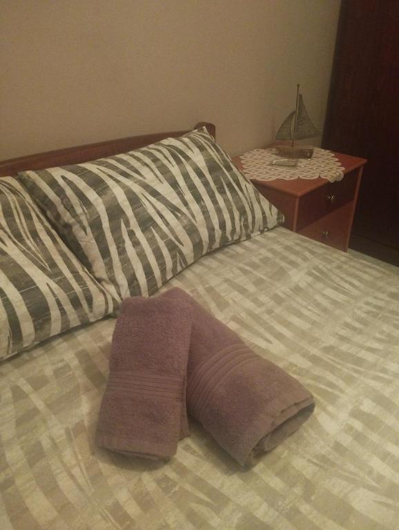Postel nebo postele na pokoji v ubytování zoi apartment
