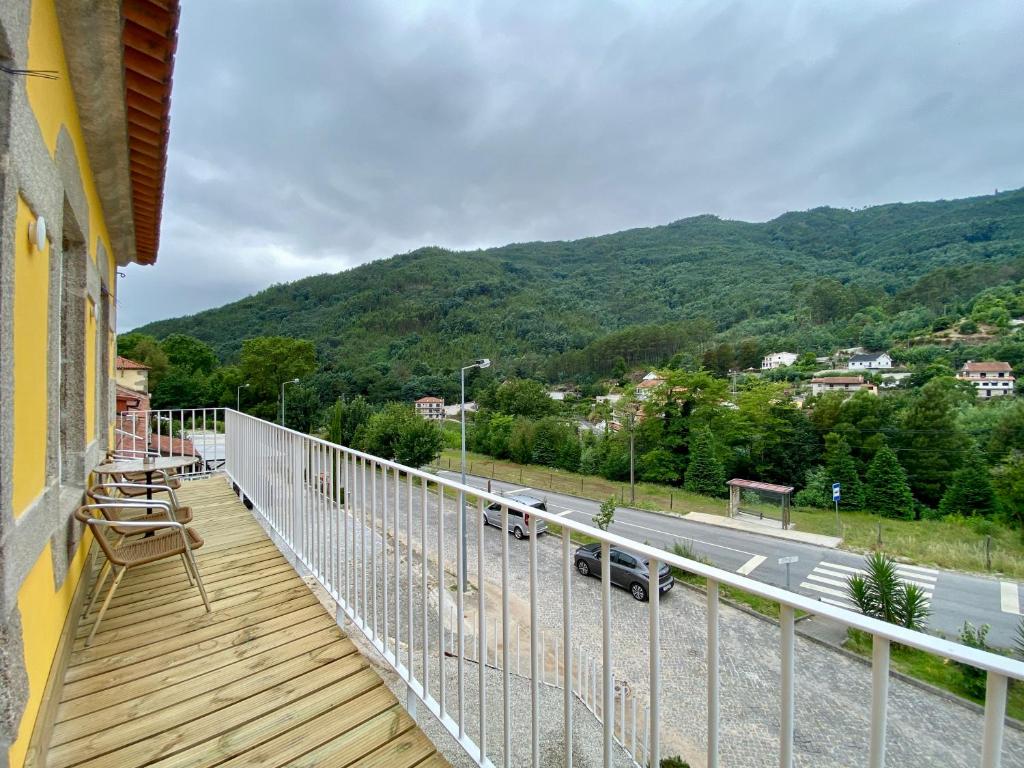 a balcony of a house with a view of a road at Gerês Distinto - Francisco in Geres