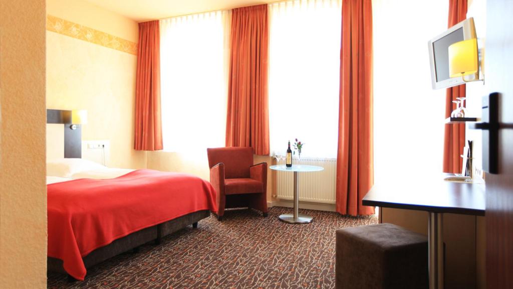Postel nebo postele na pokoji v ubytování Adesso Hotel Kassel -pay at property on arrival- Ihr Automatenhotel in Kassel