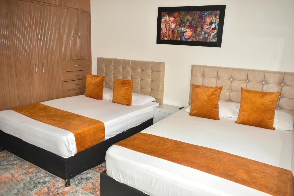 Postel nebo postele na pokoji v ubytování Hotel Flamante Bulevar