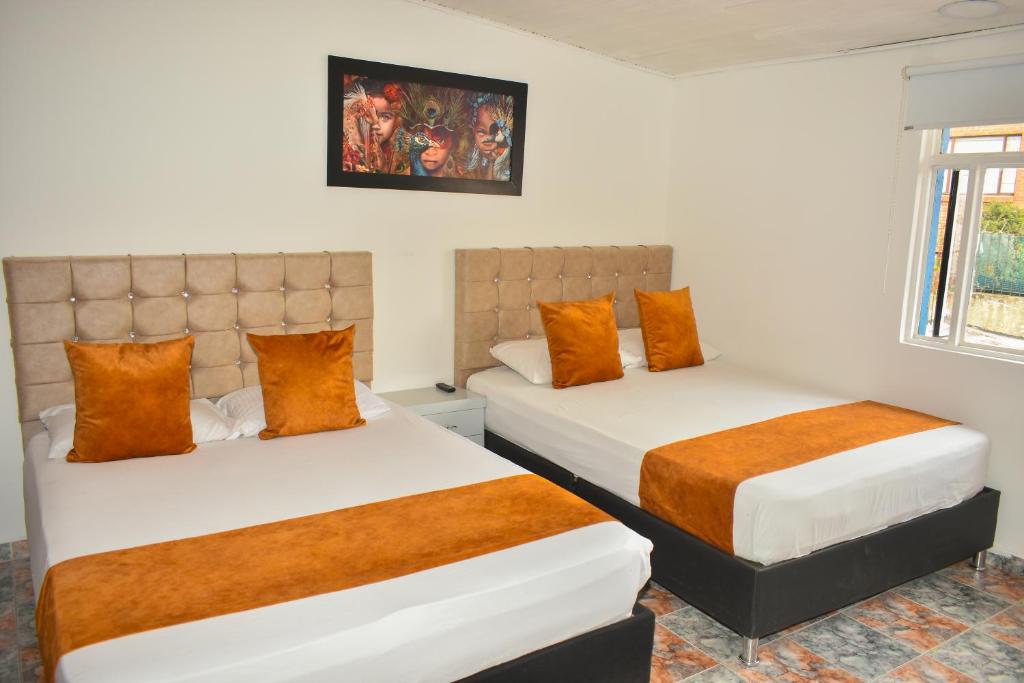 Postel nebo postele na pokoji v ubytování Hotel Flamante Bulevar