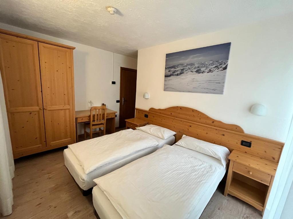 Postel nebo postele na pokoji v ubytování Hotel Zanella
