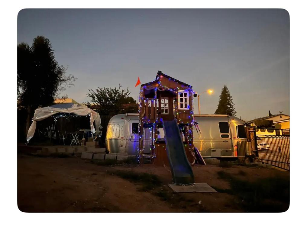 a playground with a house on it in a yard at Airstream Get Away! in Los Angeles