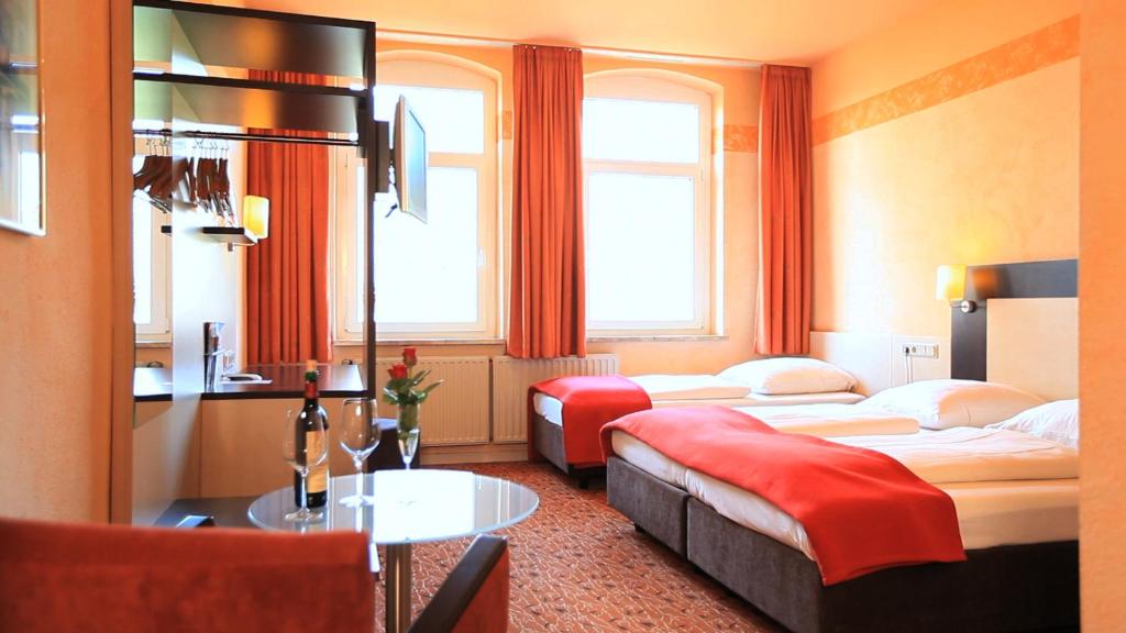 Postel nebo postele na pokoji v ubytování Adesso Hotel Kassel -pay at property on arrival- Ihr Automatenhotel in Kassel