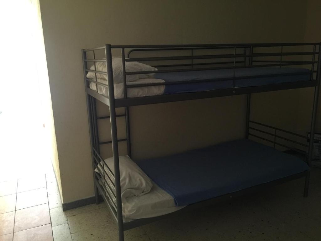 Postel nebo postele na pokoji v ubytování Tenerife Hostel