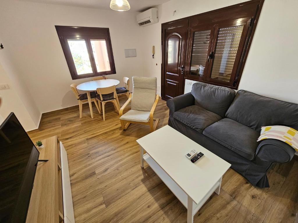 a living room with a couch and a table at Ático Alameda in Santa Cruz de la Palma