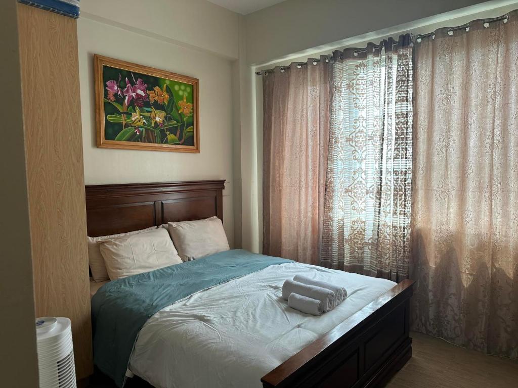 Postel nebo postele na pokoji v ubytování One Madison Place, Tower 2 - 10N MEGAWORLD Iloilo