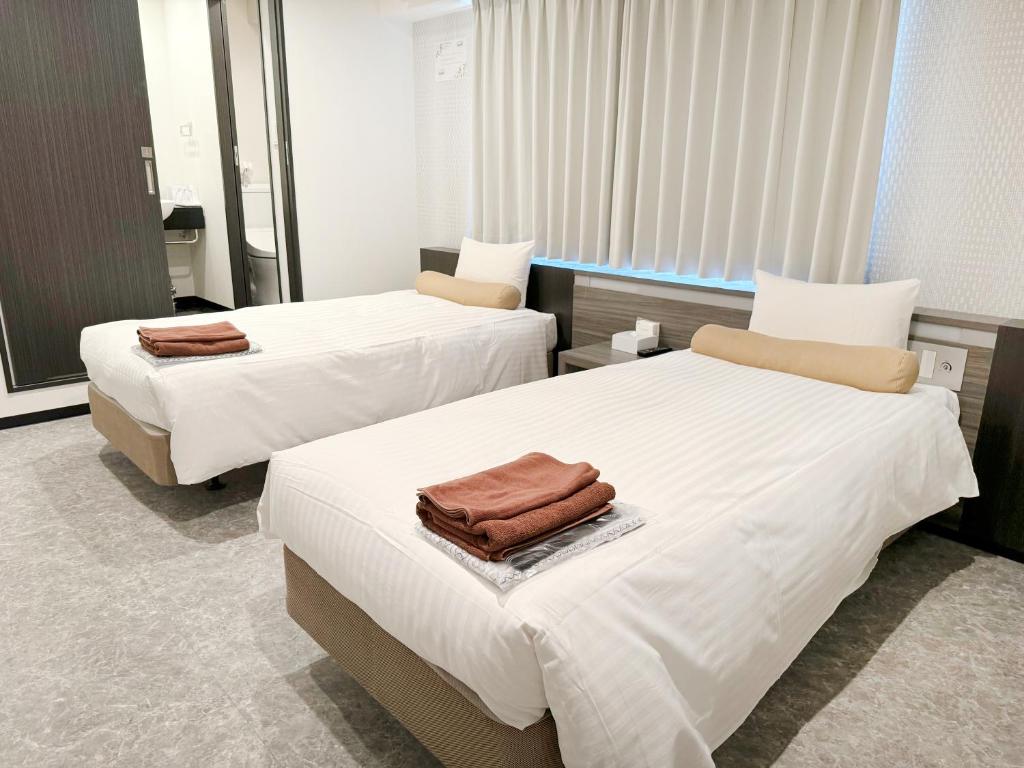 Postel nebo postele na pokoji v ubytování RE Hotel 梅田