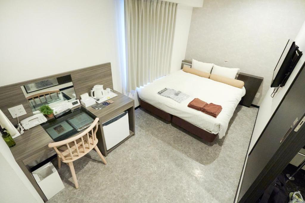 Postel nebo postele na pokoji v ubytování RE Hotel 梅田