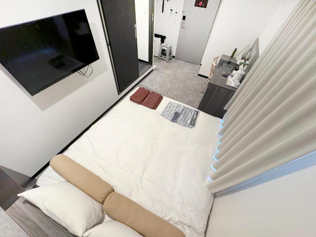Postel nebo postele na pokoji v ubytování RE Hotel 梅田