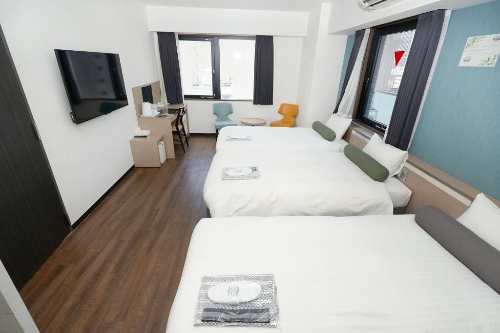 Postel nebo postele na pokoji v ubytování RE Hotel 梅田