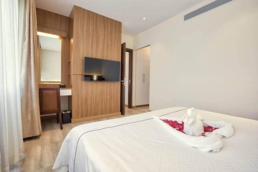 Postel nebo postele na pokoji v ubytování Le President Hotel