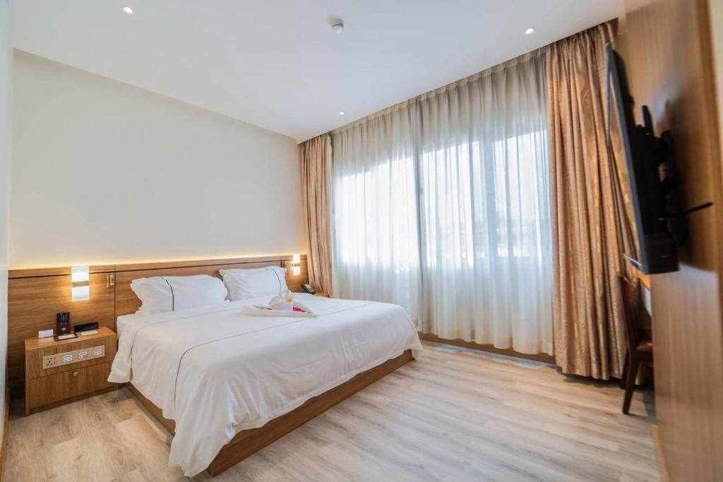 Postel nebo postele na pokoji v ubytování Le President Hotel
