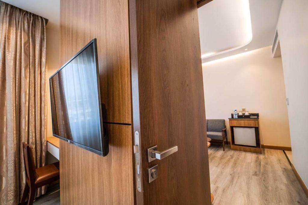 TV a/nebo společenská místnost v ubytování Le President Hotel