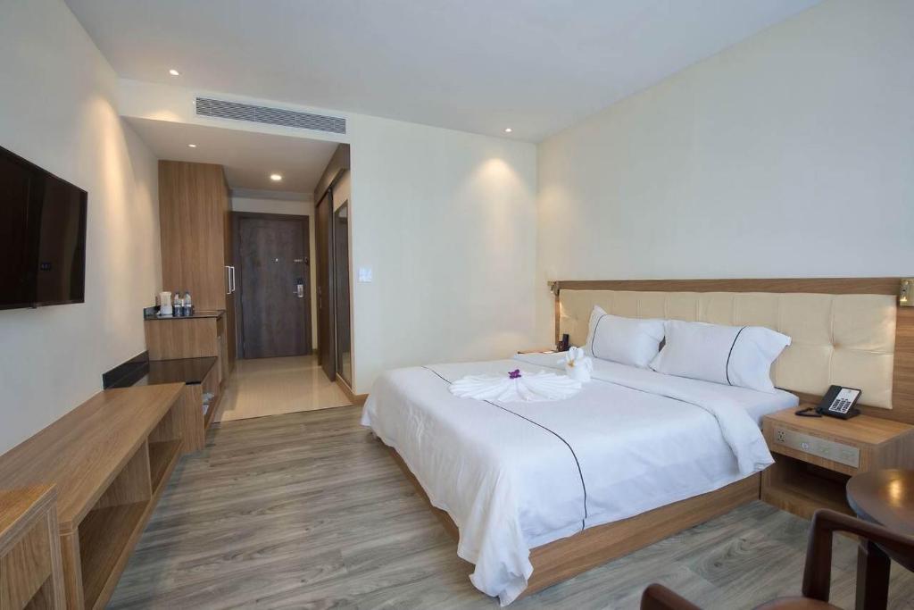 Postel nebo postele na pokoji v ubytování Le President Hotel