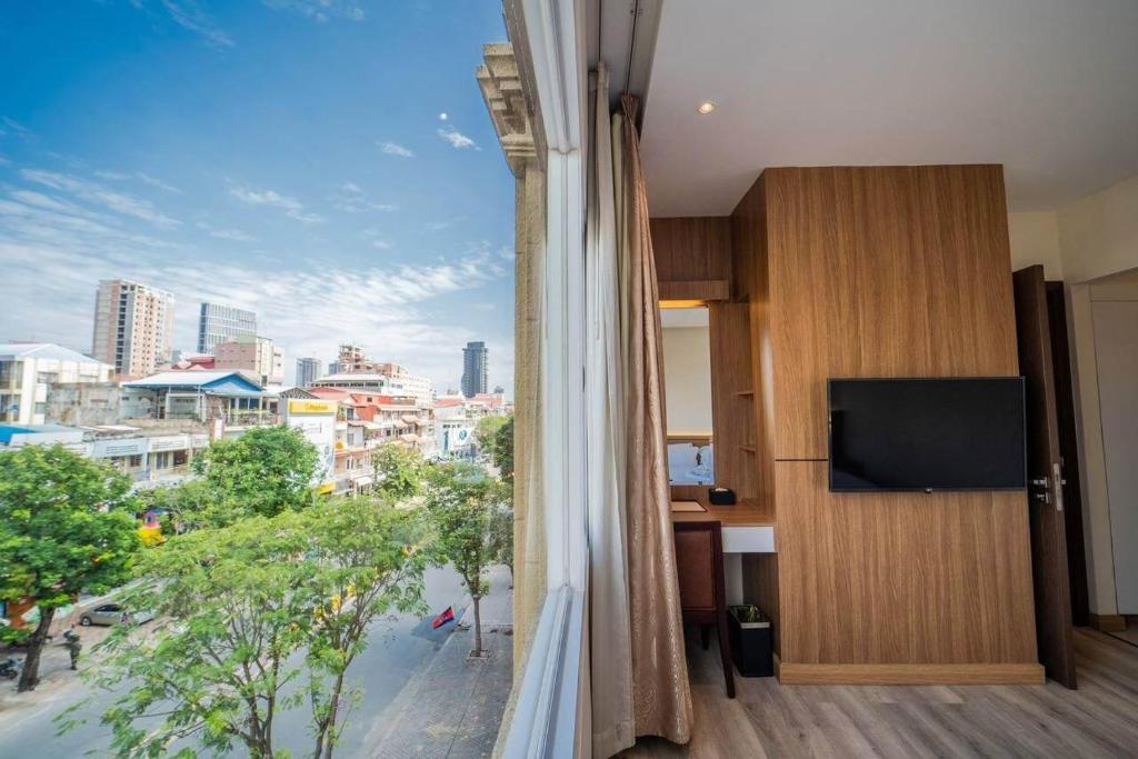 TV a/nebo společenská místnost v ubytování Le President Hotel