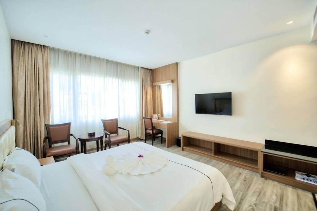 TV a/nebo společenská místnost v ubytování Le President Hotel