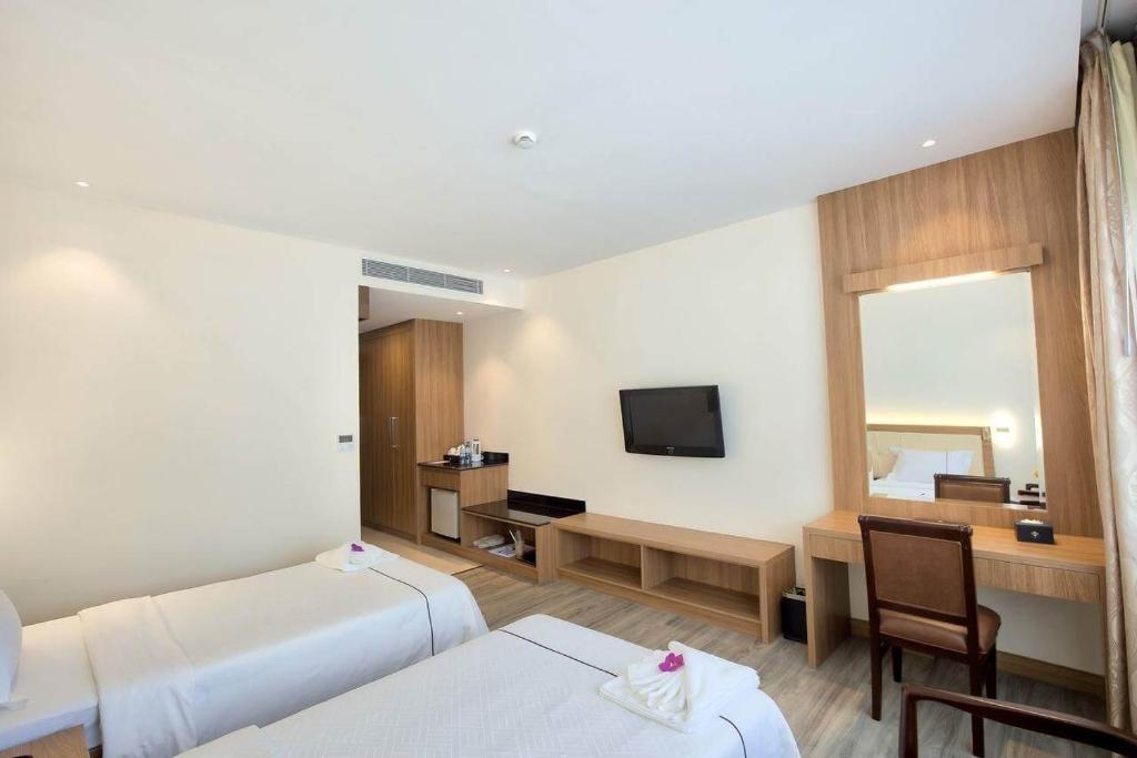 TV a/nebo společenská místnost v ubytování Le President Hotel