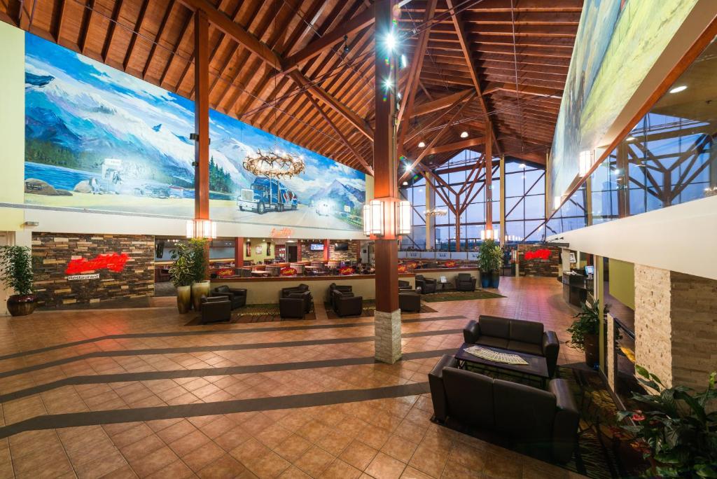 a lobby with a large mural on the wall at Super 8 by Wyndham Sherwood Park/Edmonton Area in Sherwood Park