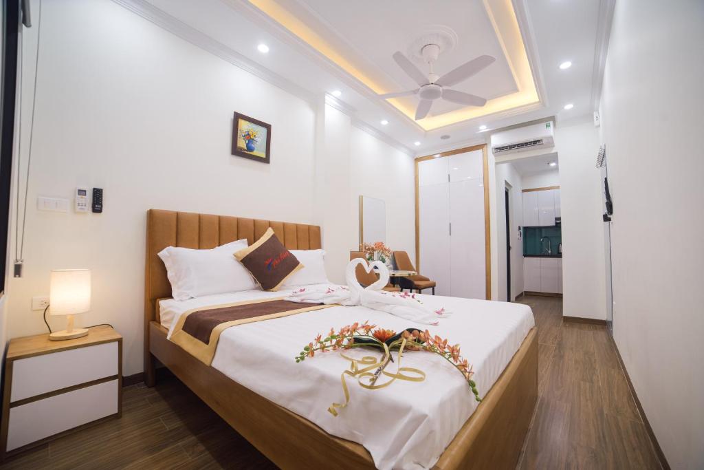 Postel nebo postele na pokoji v ubytování Pho Nang Hotel
