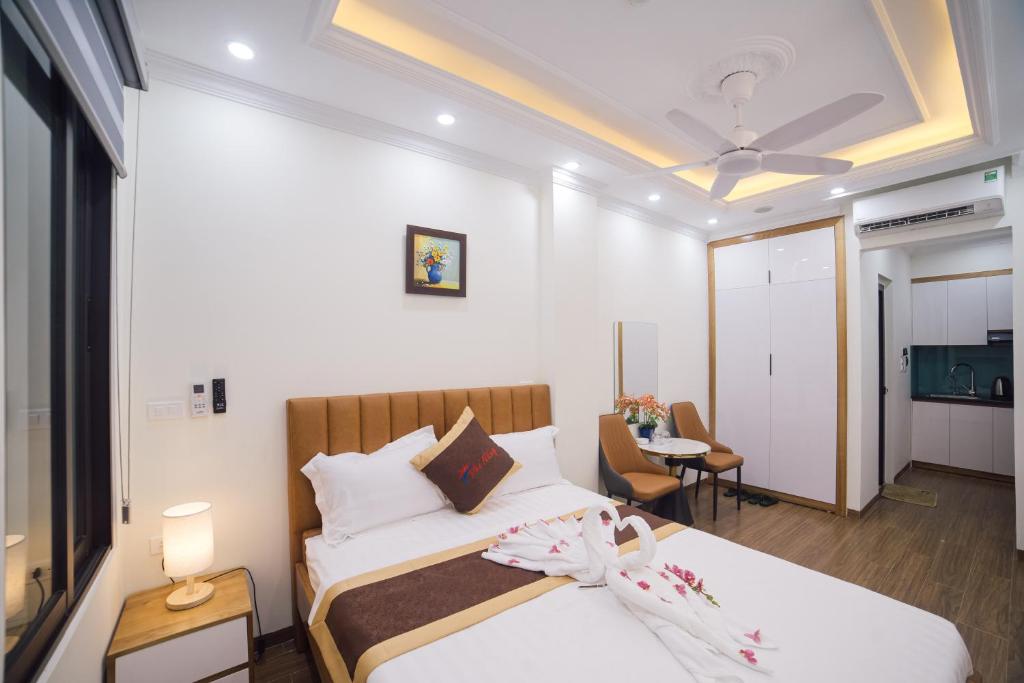 Postel nebo postele na pokoji v ubytování Pho Nang Hotel