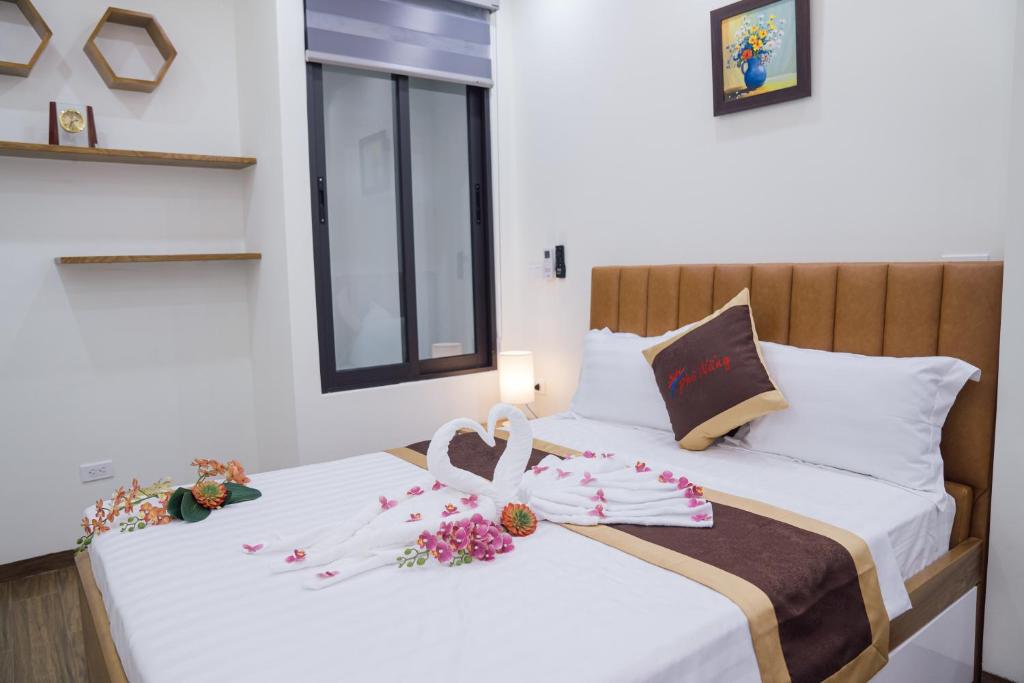 Postel nebo postele na pokoji v ubytování Pho Nang Hotel