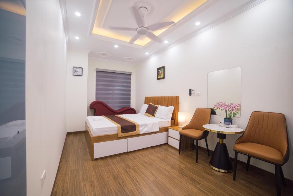 Postel nebo postele na pokoji v ubytování Pho Nang Hotel